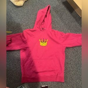 Magenta stussy sweatshirt with crown on front